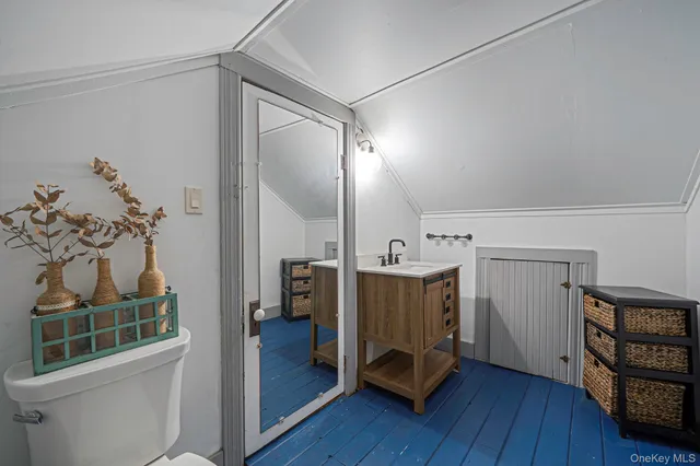 a view of a hallway with furniture