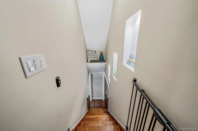 a view of a house with a patio and a yard