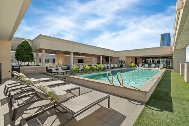 a view of house with swimming pool outdoor seating