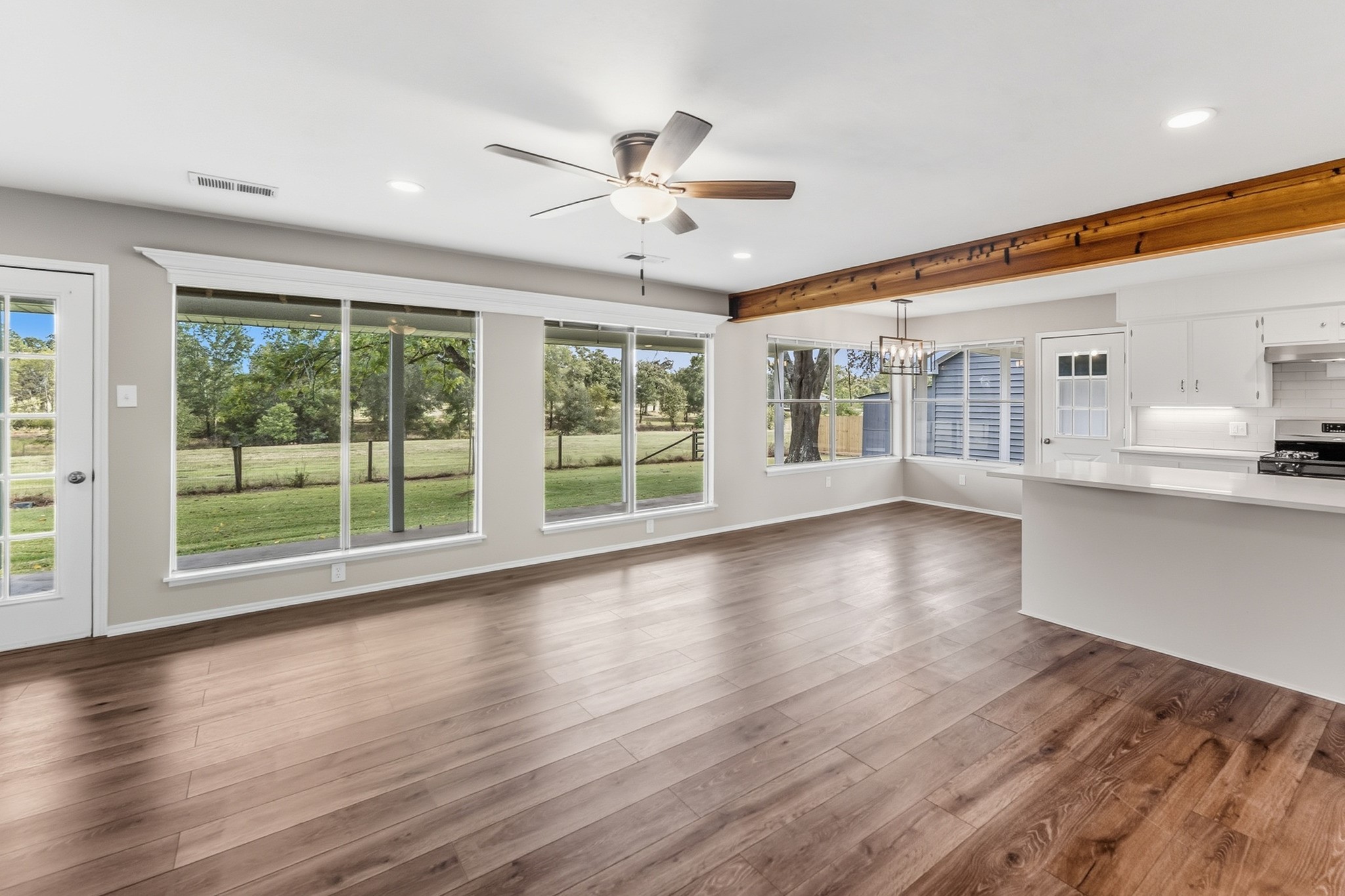 791 Farm To Market 1617 Trinity, TX 75862 - Photo 12 of 50 a view of an empty room with wooden floor and a window