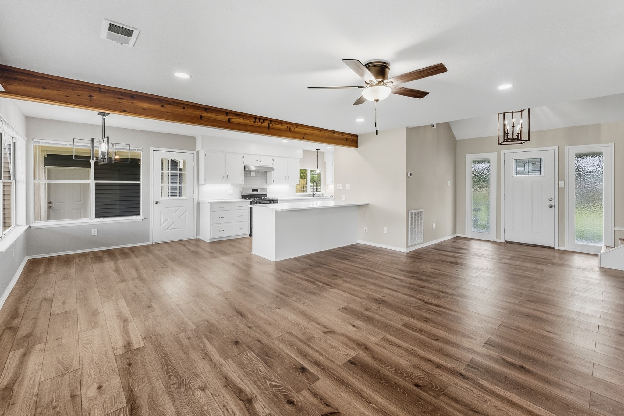 791 Farm To Market 1617 Trinity, TX 75862 - Photo 13 of 50 an empty room with wooden floor and windows