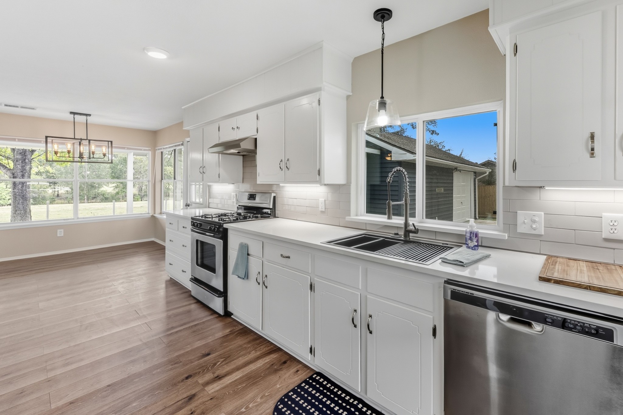 791 Farm To Market 1617 Trinity, TX 75862 - Photo 25 of 50 a kitchen with stainless steel appliances granite countertop a sink stove and wooden floor