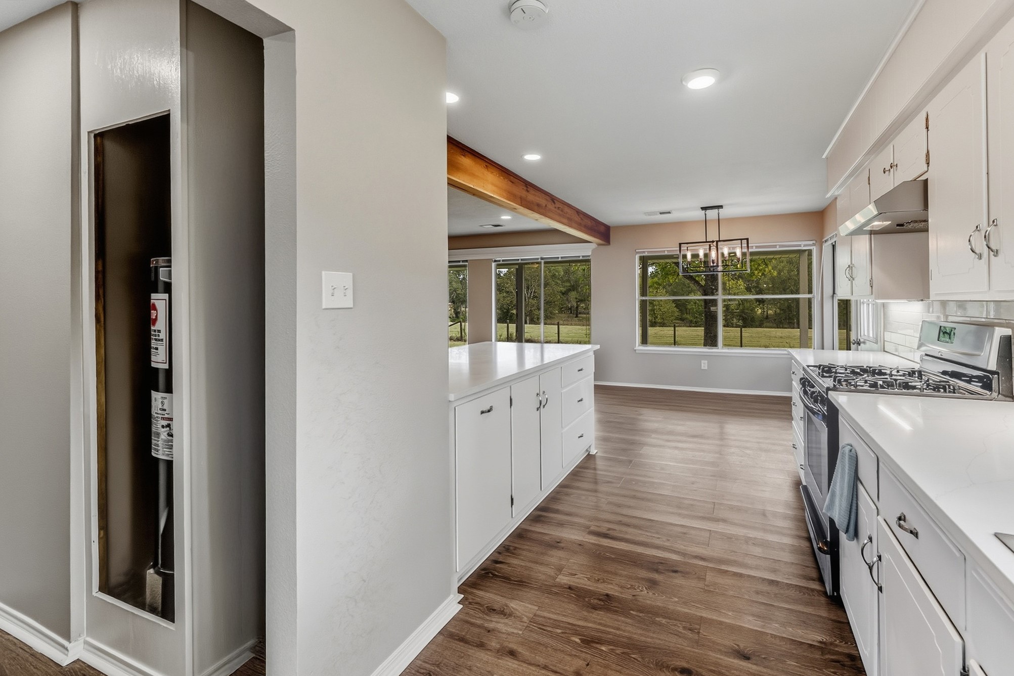 791 Farm To Market 1617 Trinity, TX 75862 - Photo 26 of 50 a kitchen with stainless steel appliances granite countertop a stove and a wooden floors