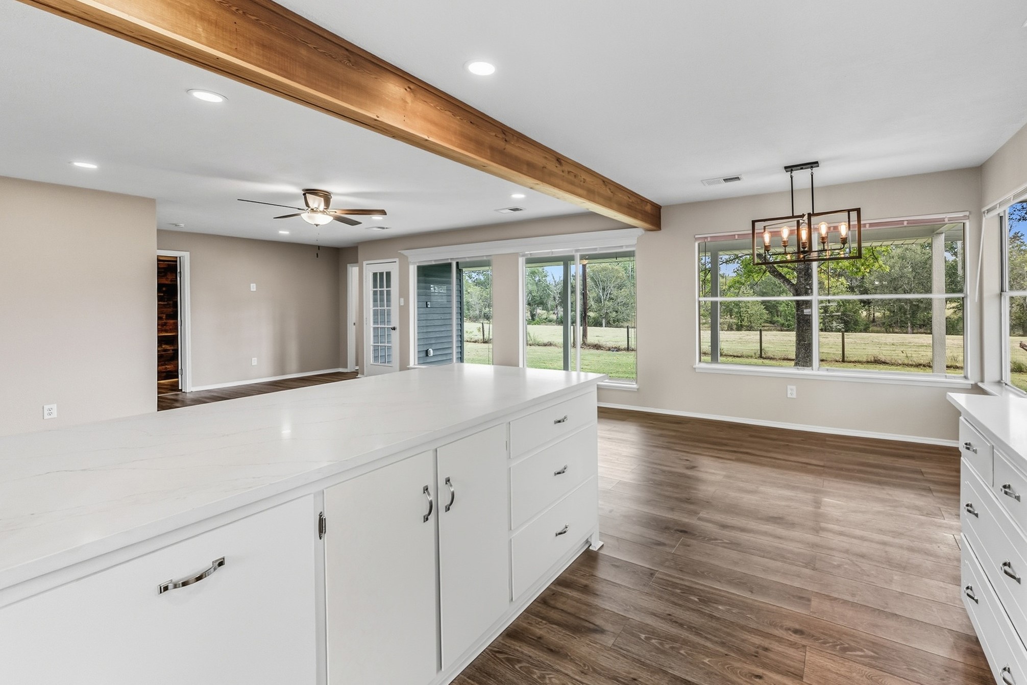 791 Farm To Market 1617 Trinity, TX 75862 - Photo 27 of 50 a view of an empty room with wooden floor and a window