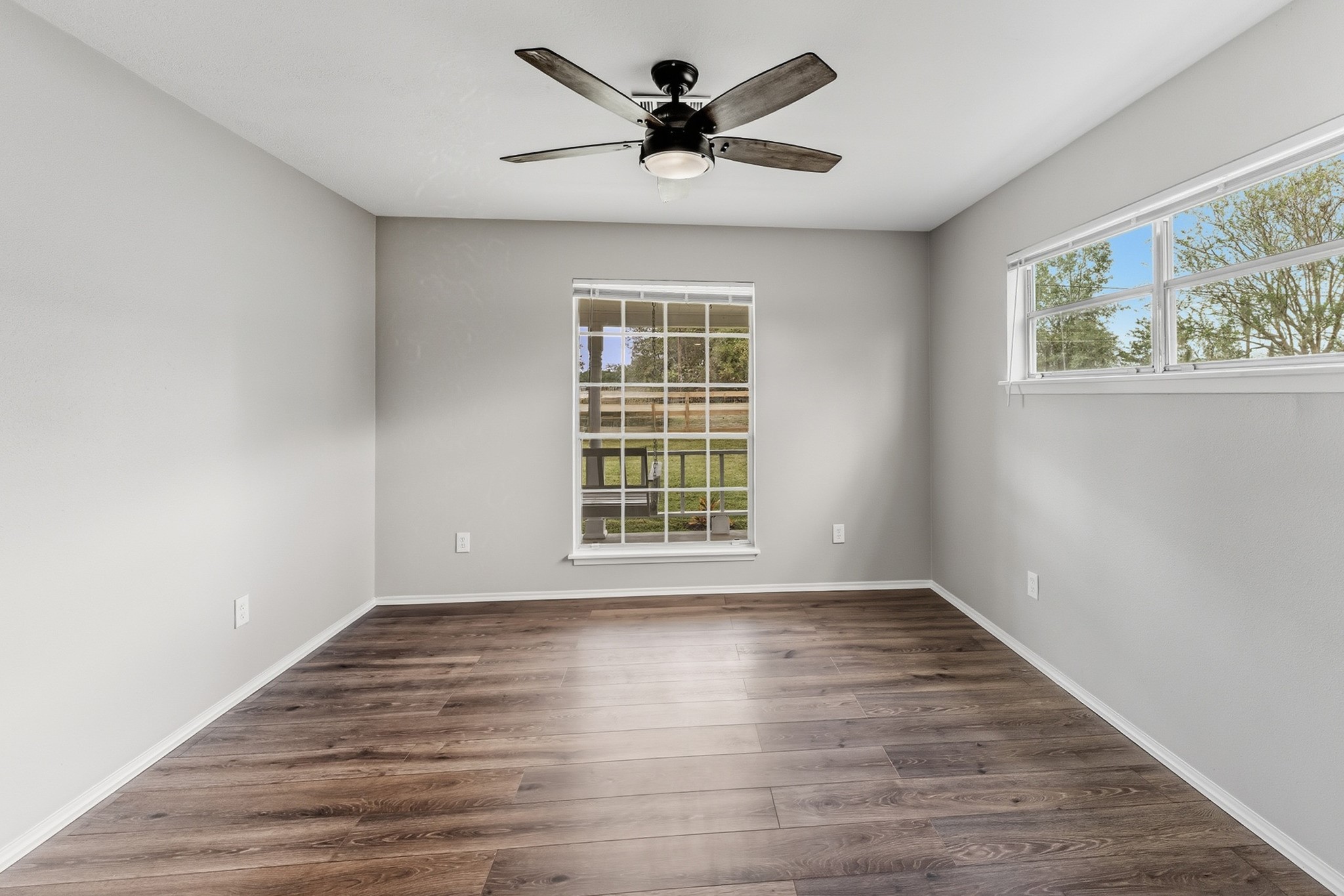 791 Farm To Market 1617 Trinity, TX 75862 - Photo 29 of 50 a view of empty room with wooden floor and fan