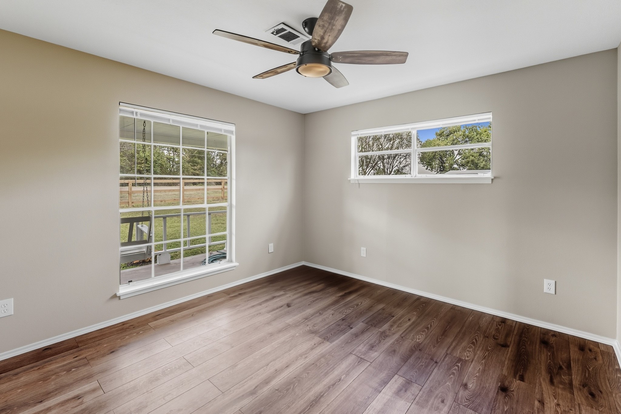 791 Farm To Market 1617 Trinity, TX 75862 - Photo 30 of 50 an empty room with window and a ceiling fan
