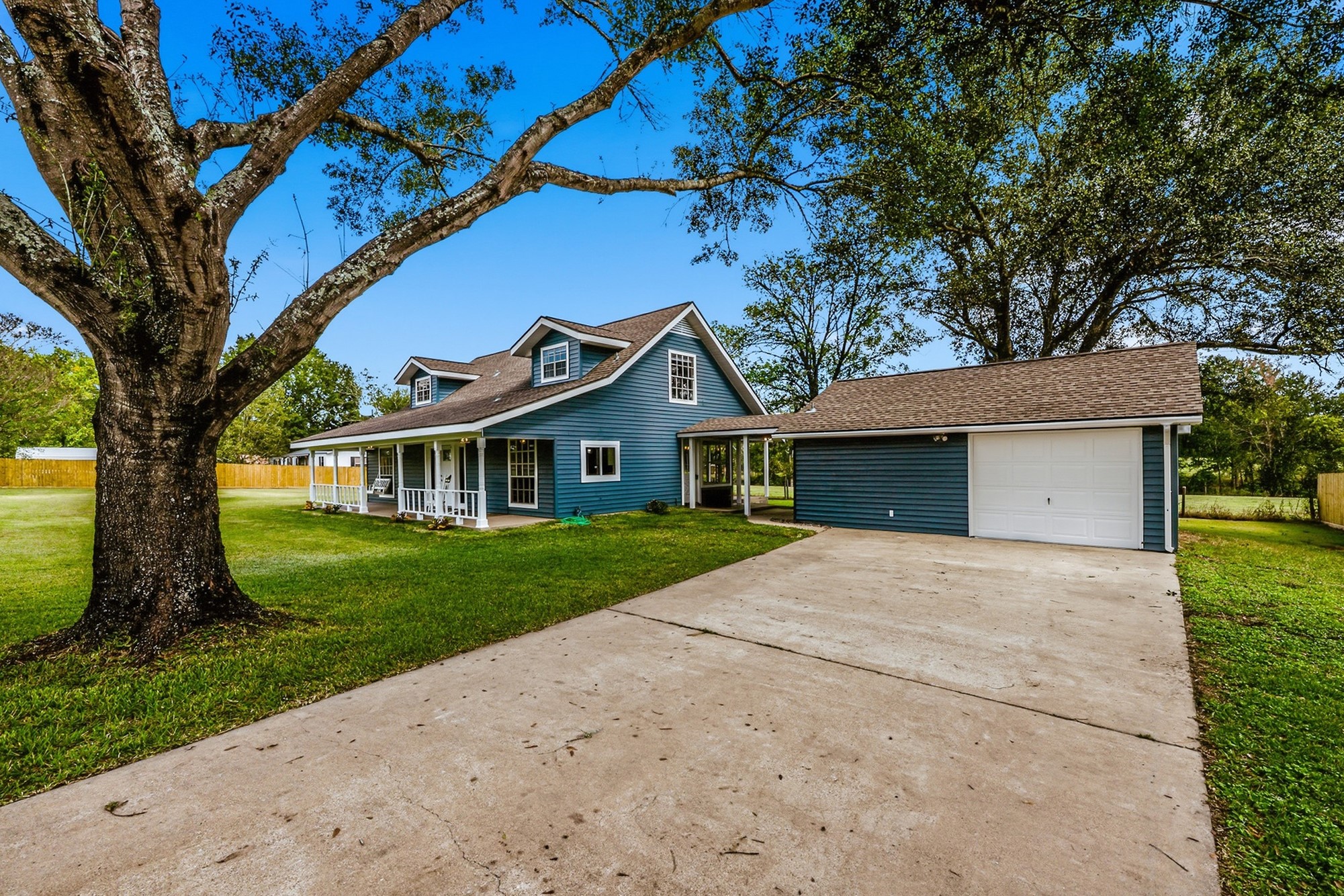 791 Farm To Market 1617 Trinity, TX 75862 - Photo 3 of 50 a front view of a house with a yard and garage