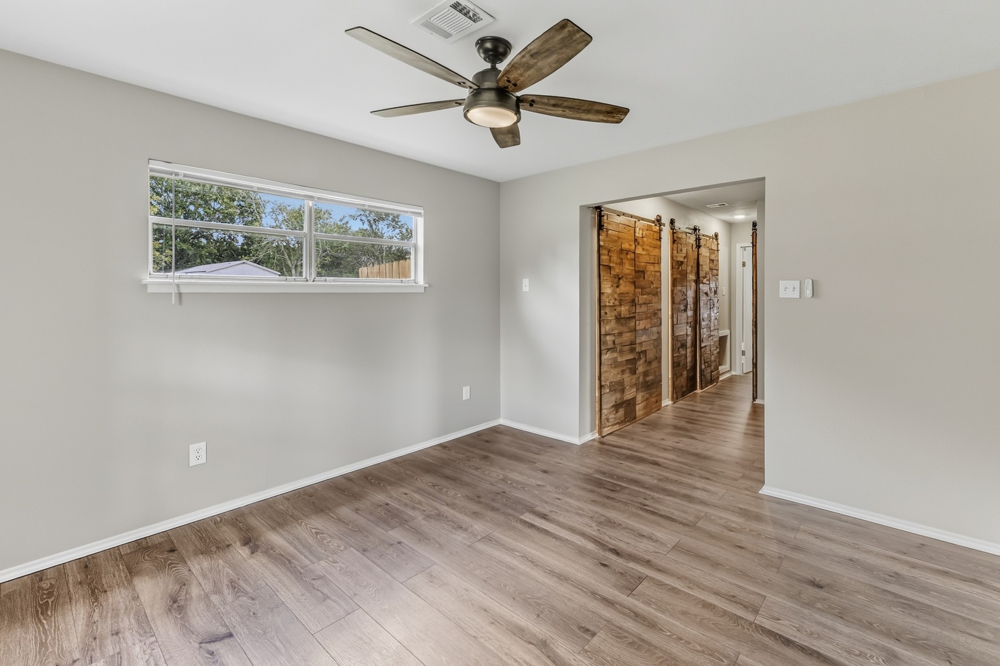 791 Farm To Market 1617 Trinity, TX 75862 - Photo 31 of 50 wooden floor in an empty room with a window