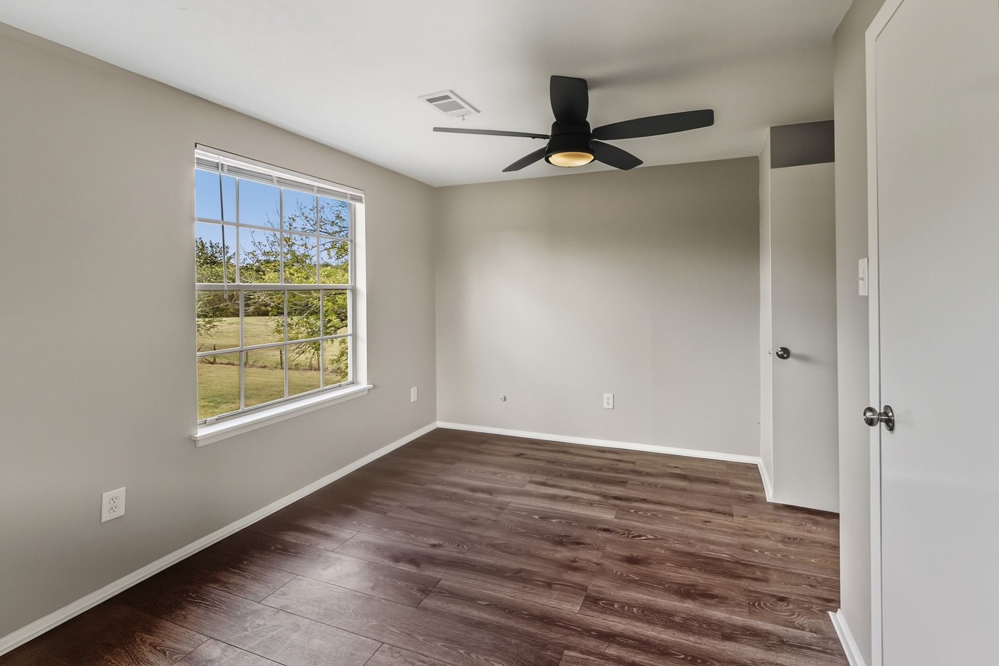 791 Farm To Market 1617 Trinity, TX 75862 - Photo 41 of 50 wooden floor in an empty room with a window