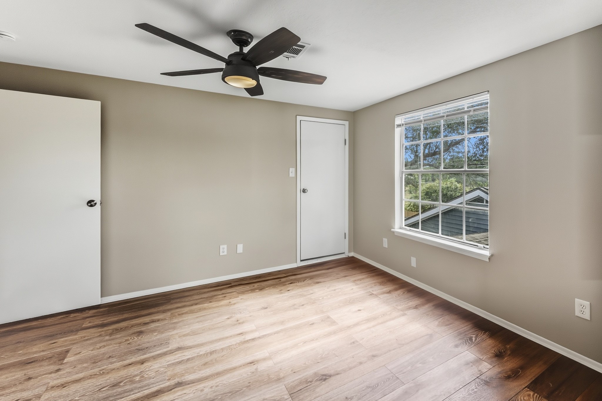 791 Farm To Market 1617 Trinity, TX 75862 - Photo 47 of 50 a view of a livingroom with a ceiling fan and wooden floor