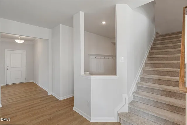 a view of entryway with wooden floor