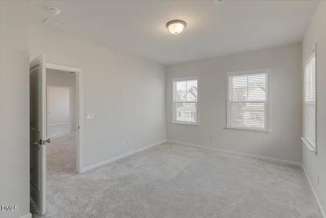 a bathroom with a sink vanity mirror and toilet