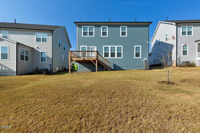 an aerial view of a house with a ocean view