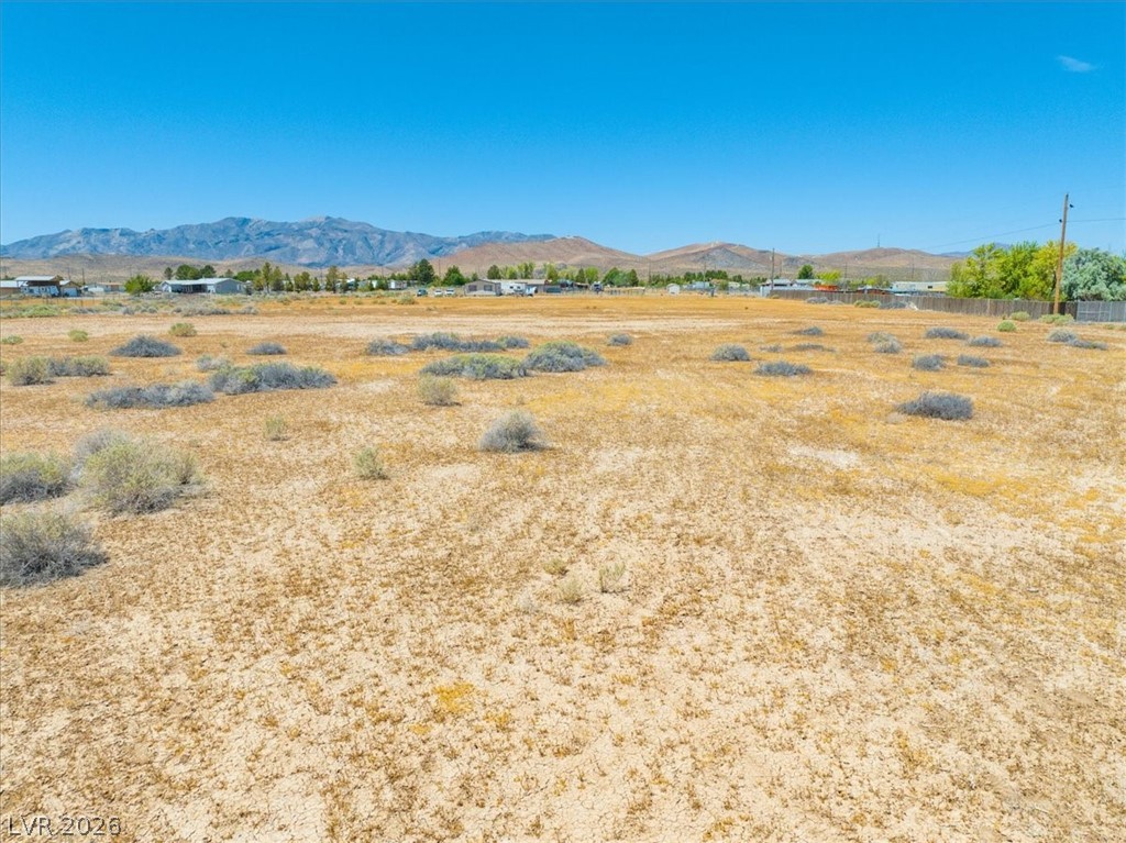 4580 Lawrence Road Pahrump, NV 89048 - Photo 19 of 40 Vast desert landscape with distant mountains offers a serene natural backdrop.
