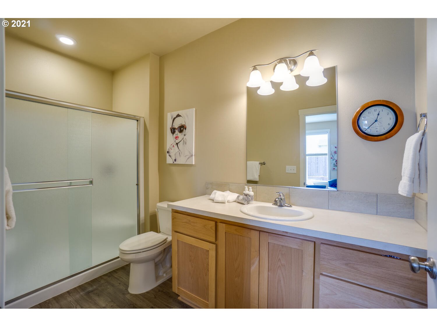 4639 North Noble Loop Ridgefield, WA 98642 - Photo 14 of 32 a bathroom with a toilet sink and mirror