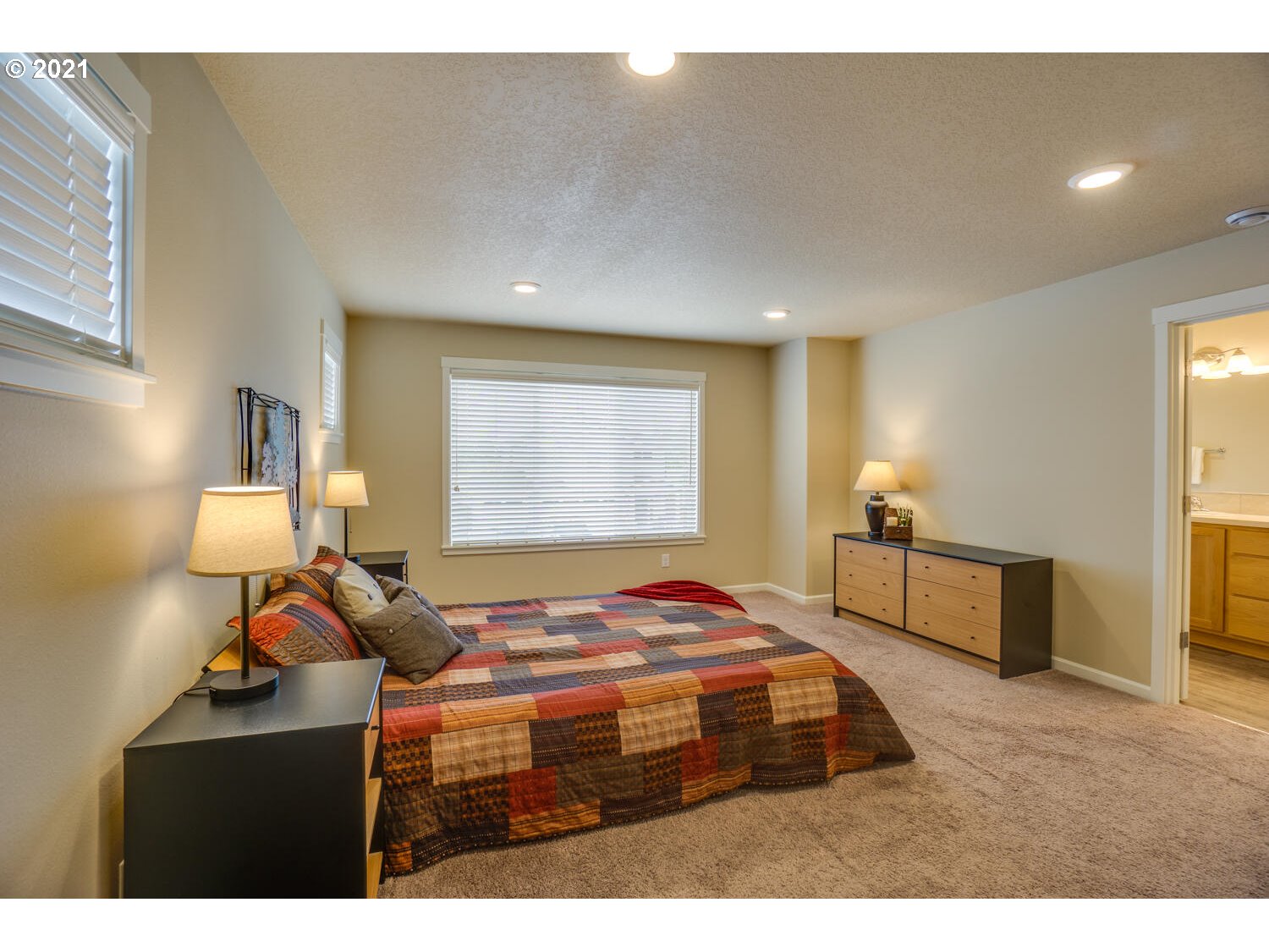 4639 North Noble Loop Ridgefield, WA 98642 - Photo 17 of 32 a bedroom with a bed and window