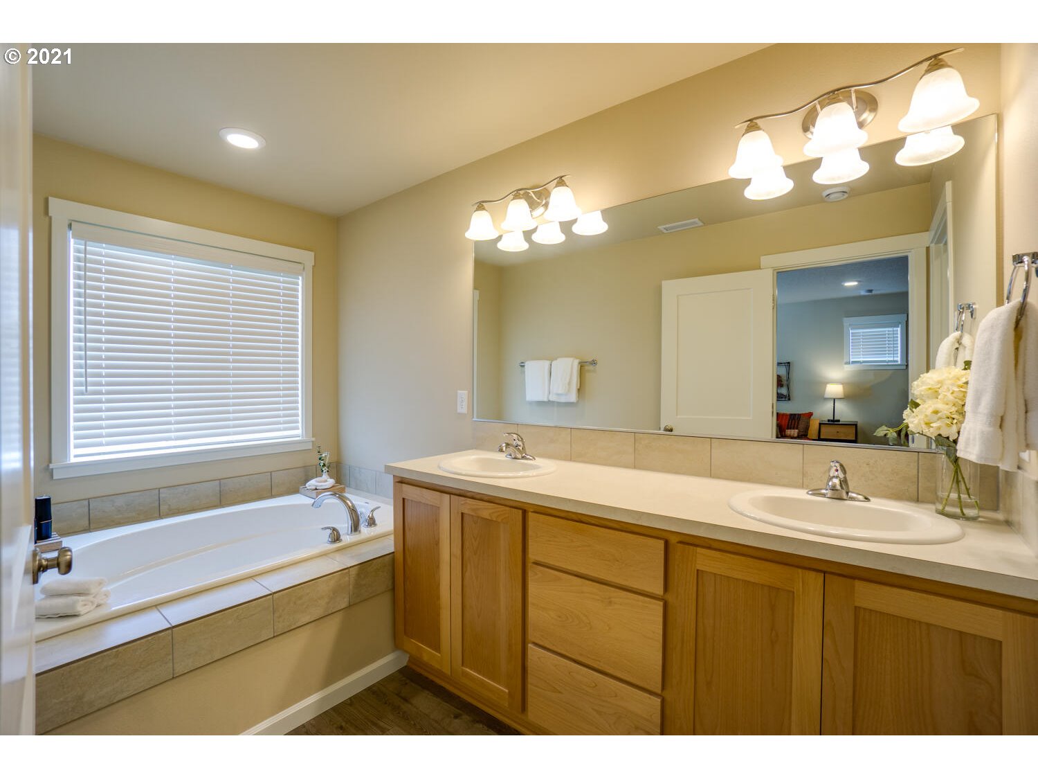 4639 North Noble Loop Ridgefield, WA 98642 - Photo 20 of 32 a bathroom with a sink double vanity granite and a mirror