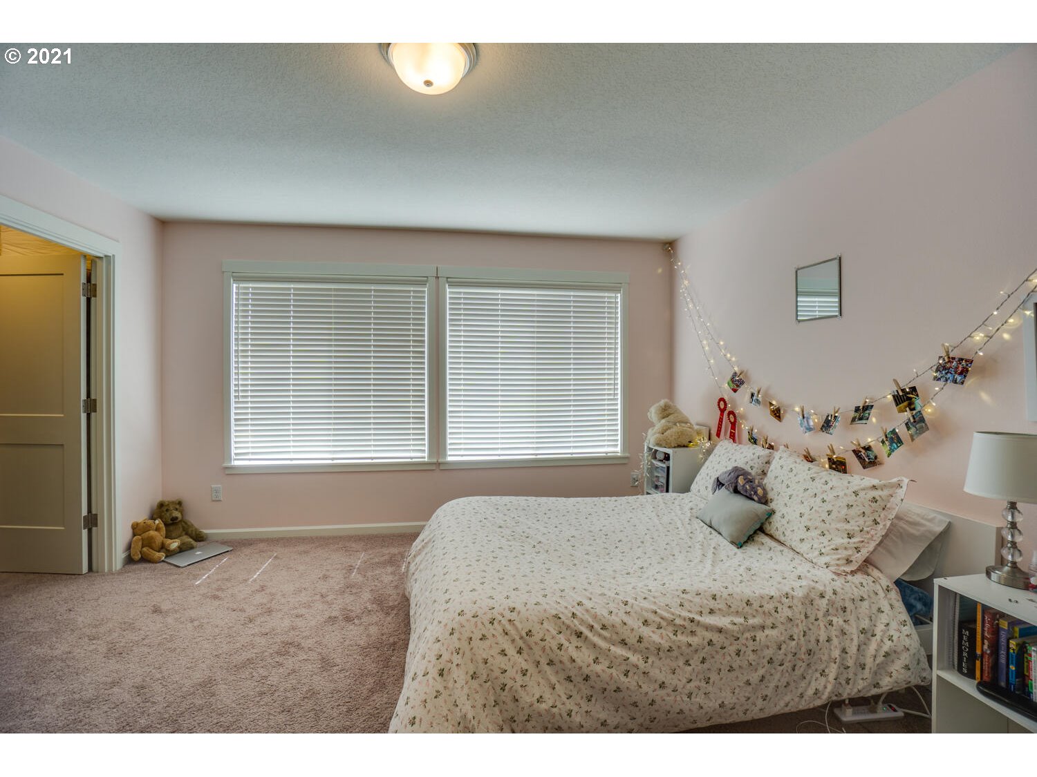 4639 North Noble Loop Ridgefield, WA 98642 - Photo 21 of 32 a bedroom with a bed and wooden floor