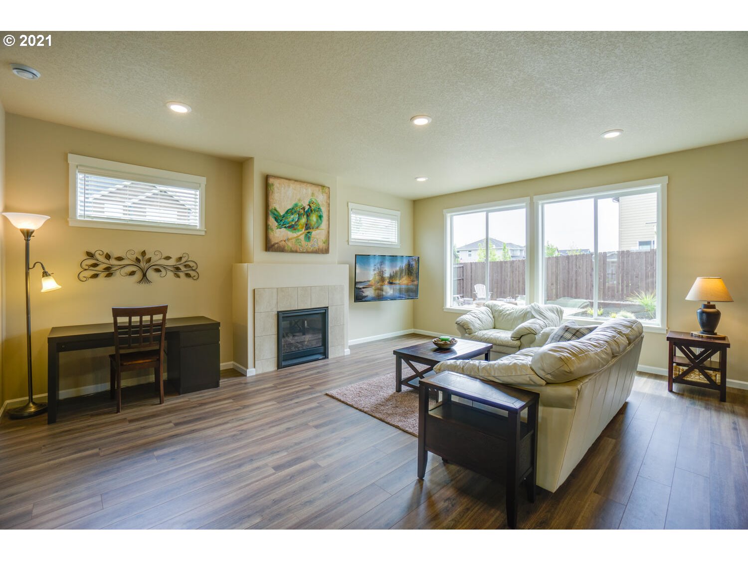 4639 North Noble Loop Ridgefield, WA 98642 - Photo 6 of 32 a living room with furniture a fireplace and a wooden floor