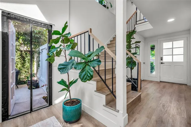 a vase of flowers sitting next to a window