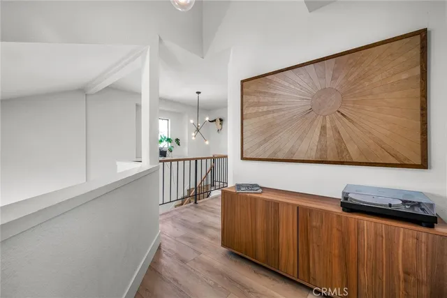 a view of a living room with wooden floor