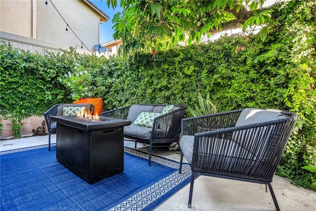 a balcony with wooden floor and outdoor seating