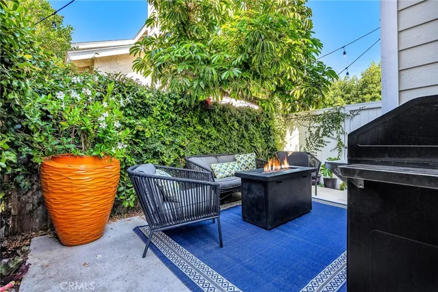 a view of a sitting area with furniture and wooden fence