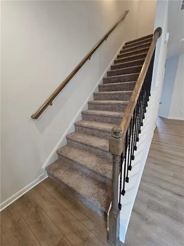 a white toilet sitting next to a bathroom sink