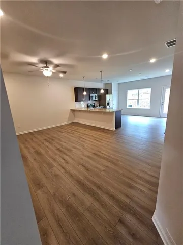 a view of a livingroom with wooden floor