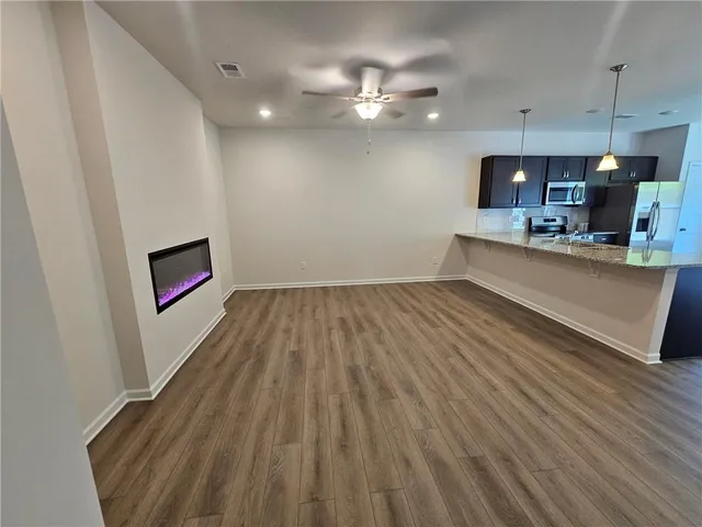 a view of kitchen island with wooden floor