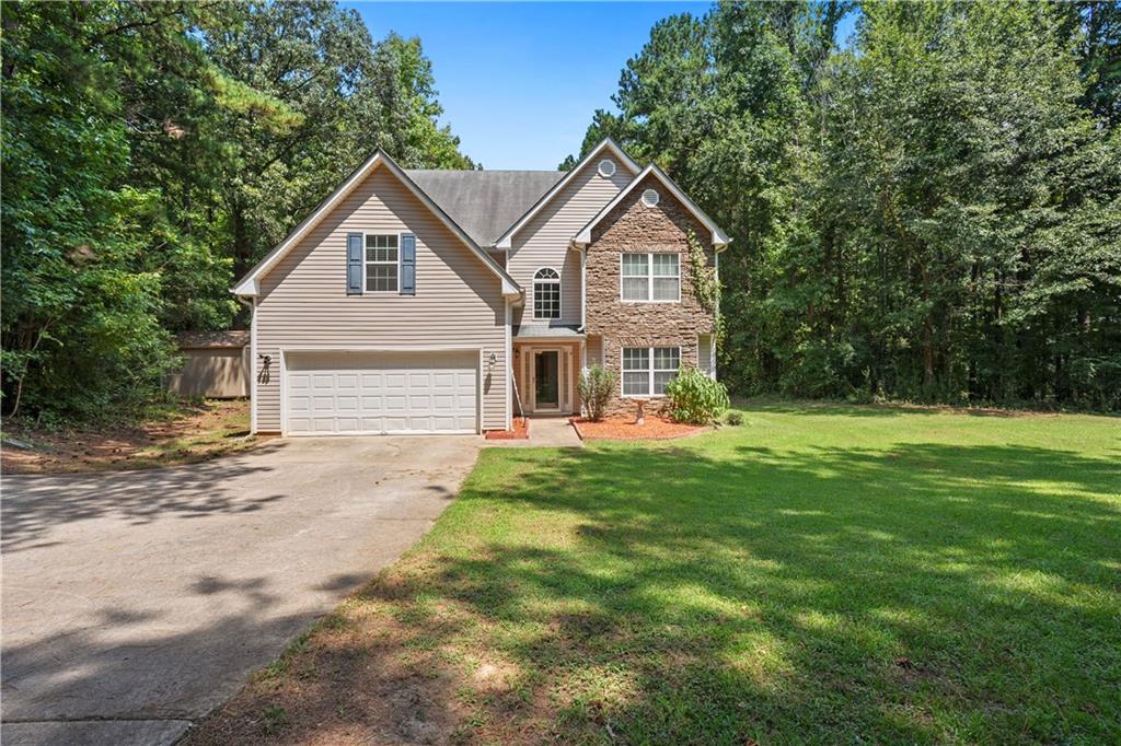 a front view of a house with yard