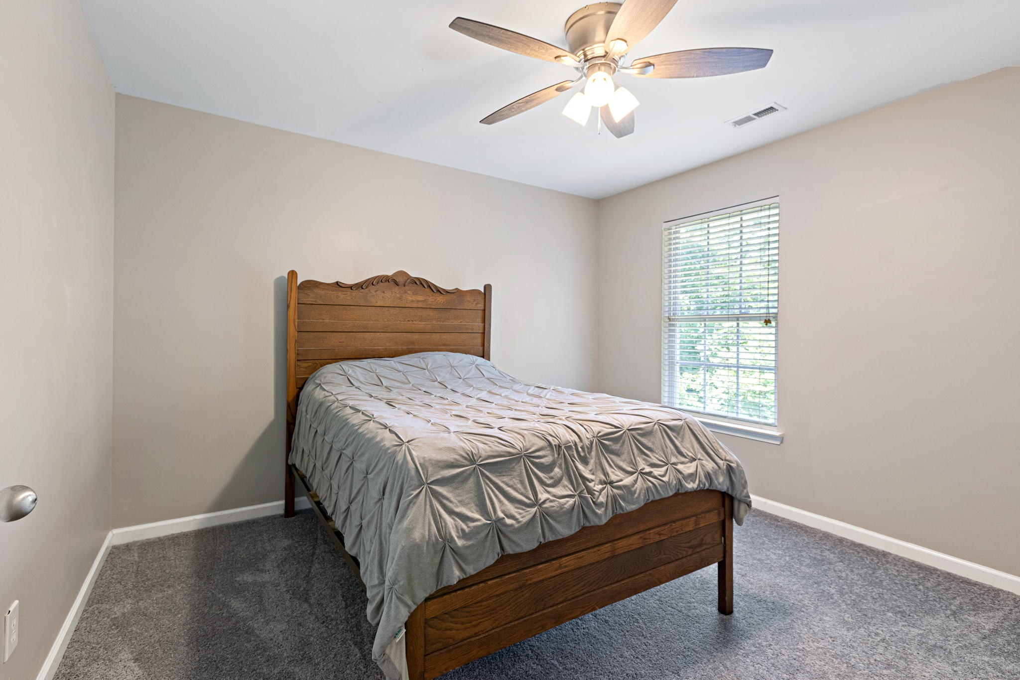944 Pebble Beach Circle Mount Juliet, TN 37122 - Photo 12 of 19 a bedroom with a bed and a chandelier