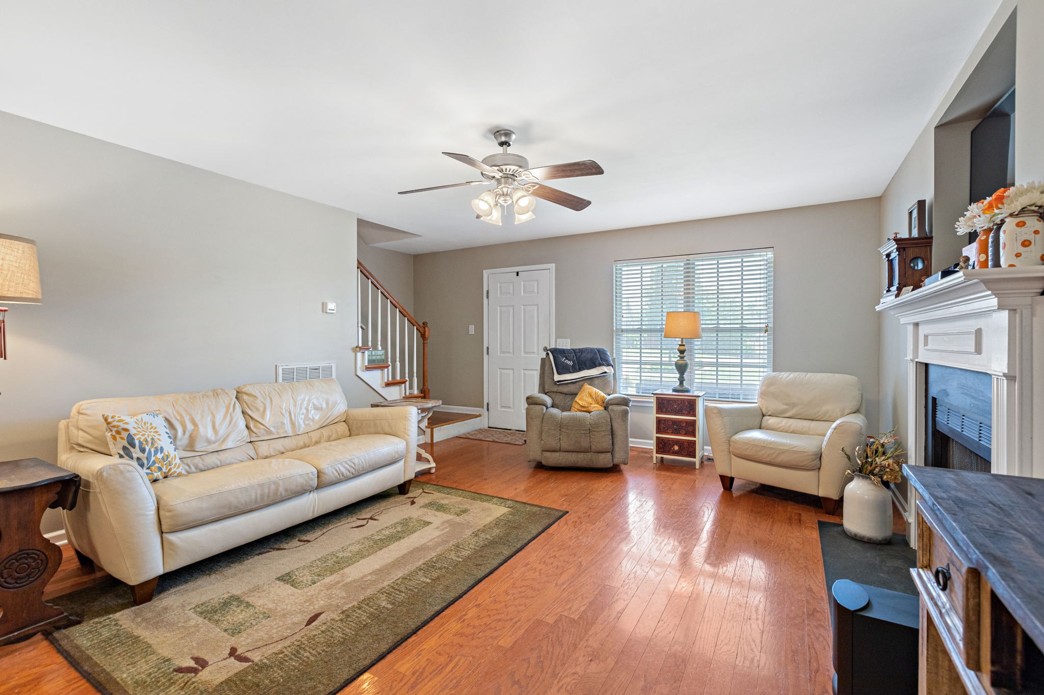 944 Pebble Beach Circle Mount Juliet, TN 37122 - Photo 4 of 19 a living room with furniture and a fireplace