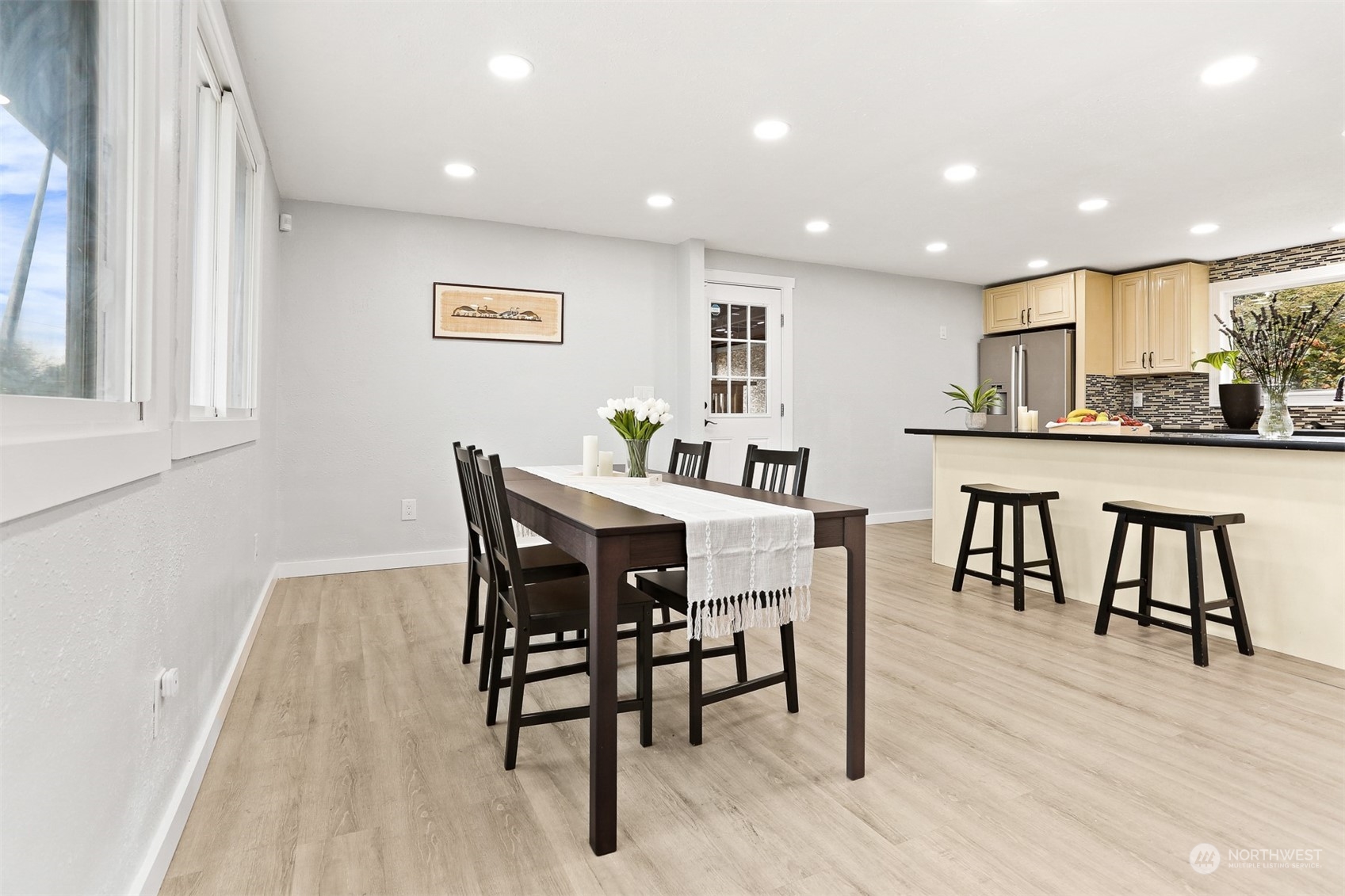 2124 High Avenue Northeast Renton, WA 98056 - Photo 12 of 37 a view of a dining room with furniture and wooden floor