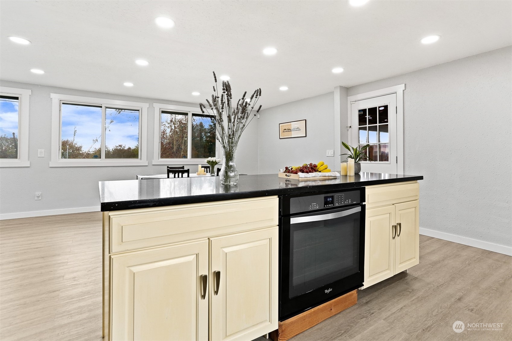2124 High Avenue Northeast Renton, WA 98056 - Photo 13 of 37 a kitchen with stainless steel appliances granite countertop a sink and cabinets
