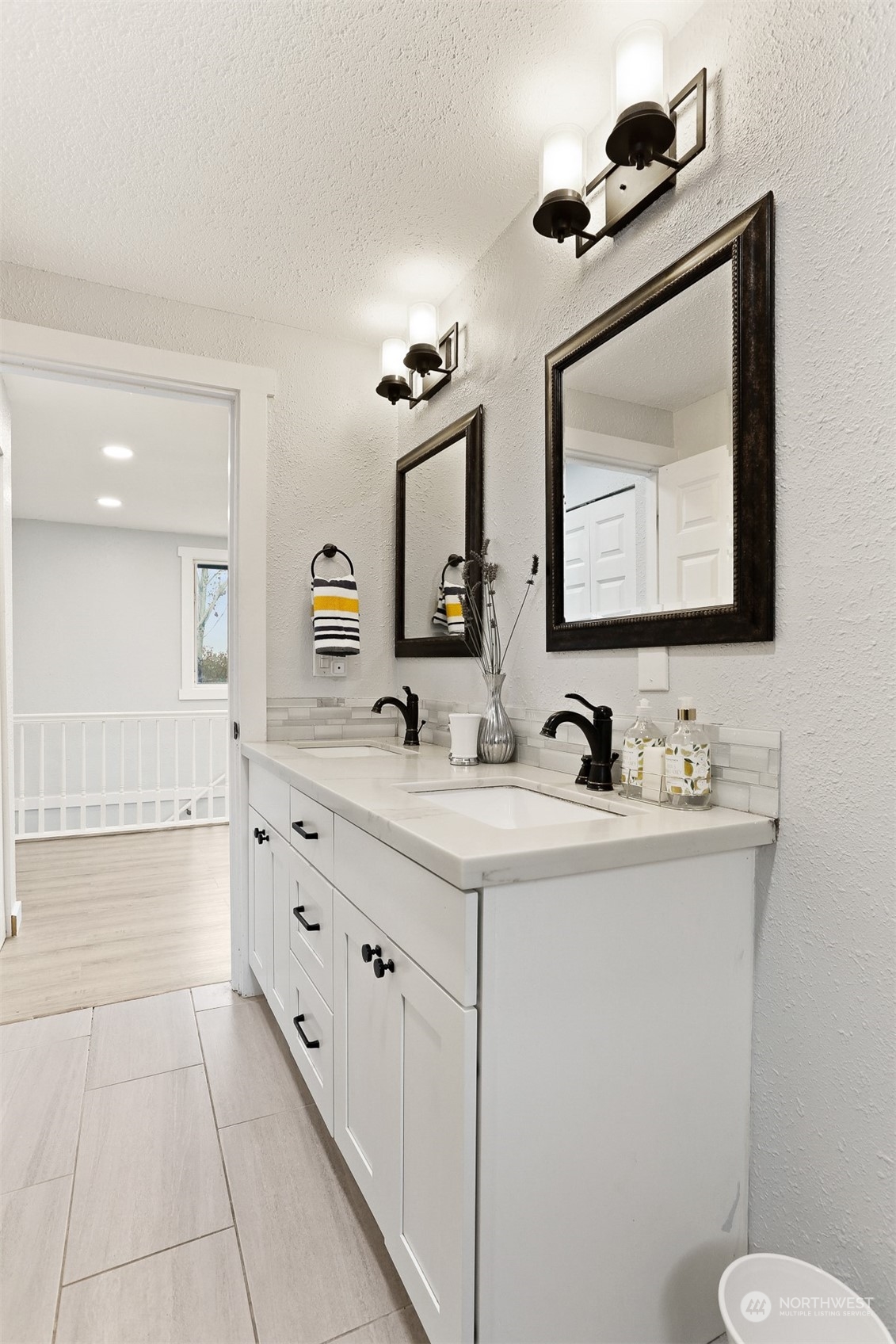 2124 High Avenue Northeast Renton, WA 98056 - Photo 20 of 37 a bathroom with a sink a toilet and mirror