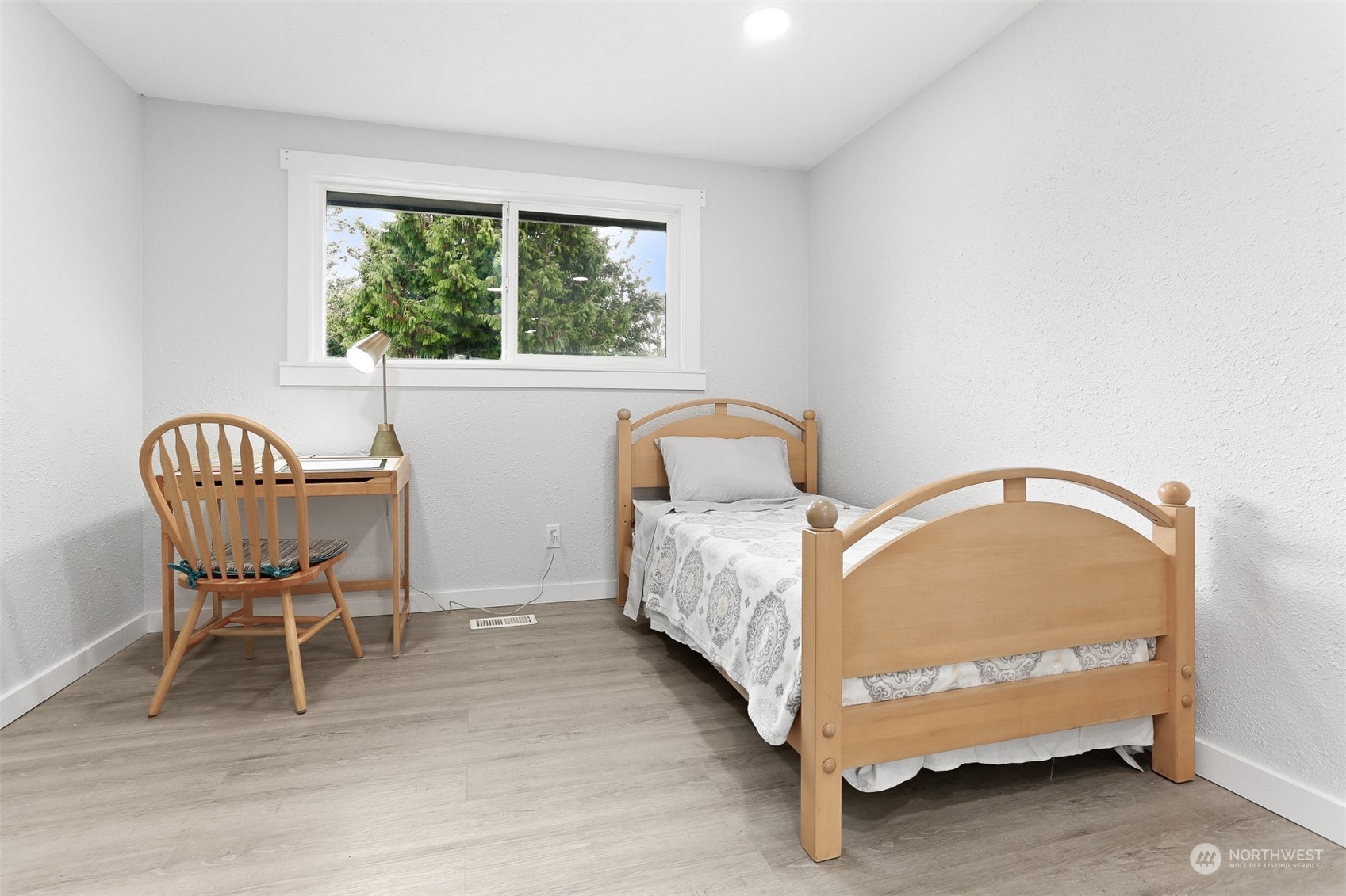 2124 High Avenue Northeast Renton, WA 98056 - Photo 23 of 37 a room with a bed and a chair