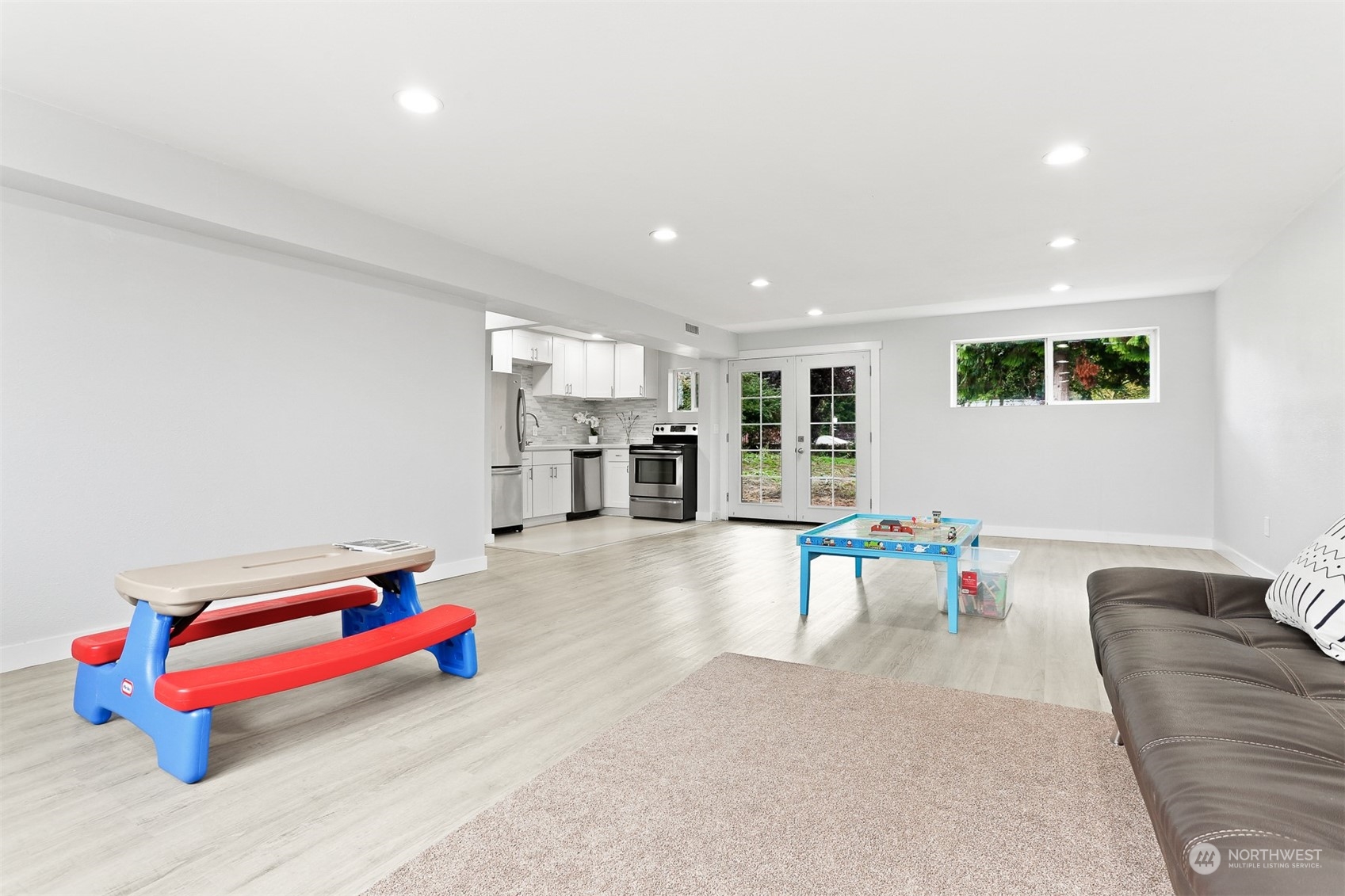 2124 High Avenue Northeast Renton, WA 98056 - Photo 30 of 37 a living room with furniture and gym equipment