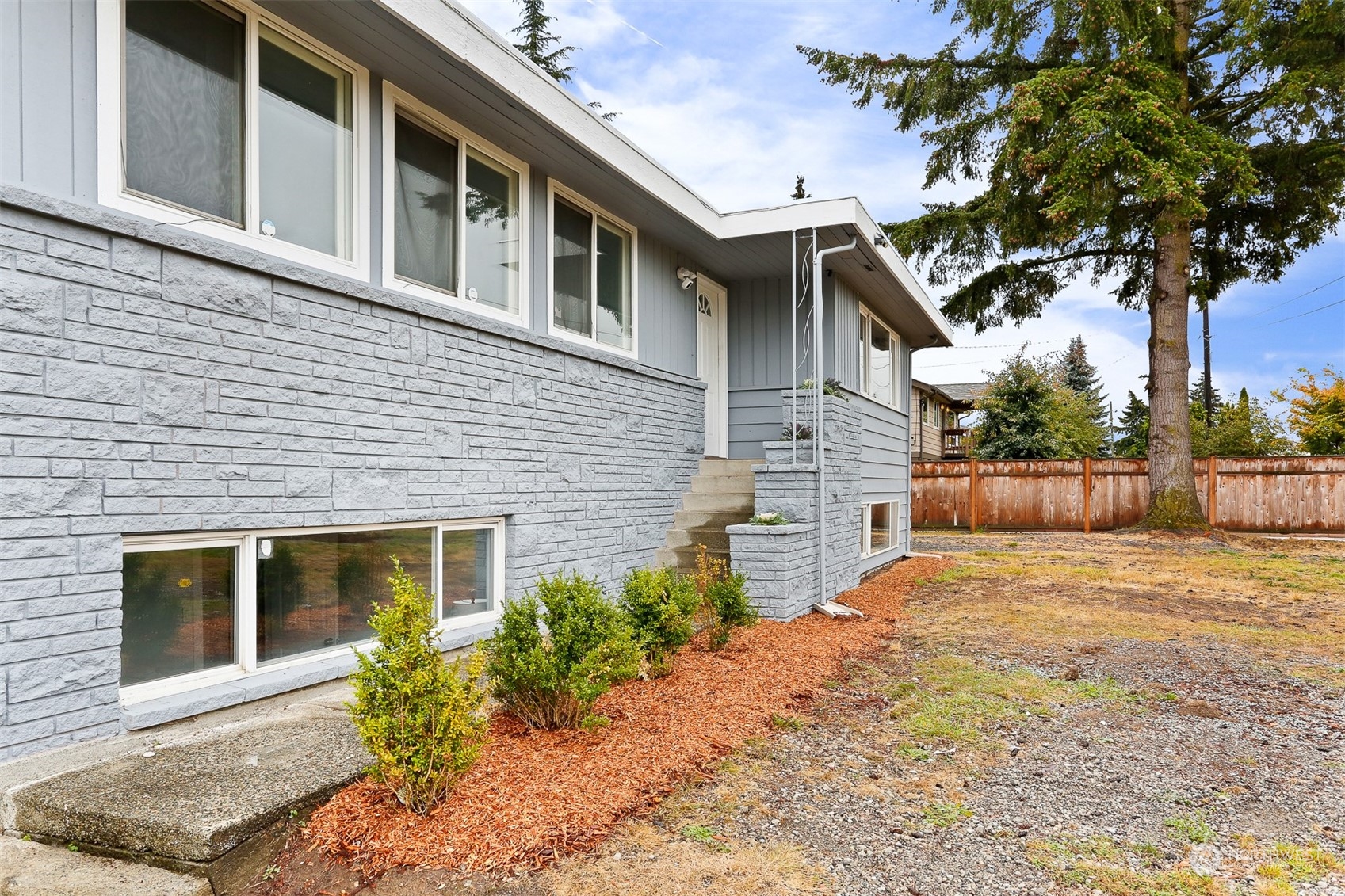 2124 High Avenue Northeast Renton, WA 98056 - Photo 3 of 37 a front view of a house with garden