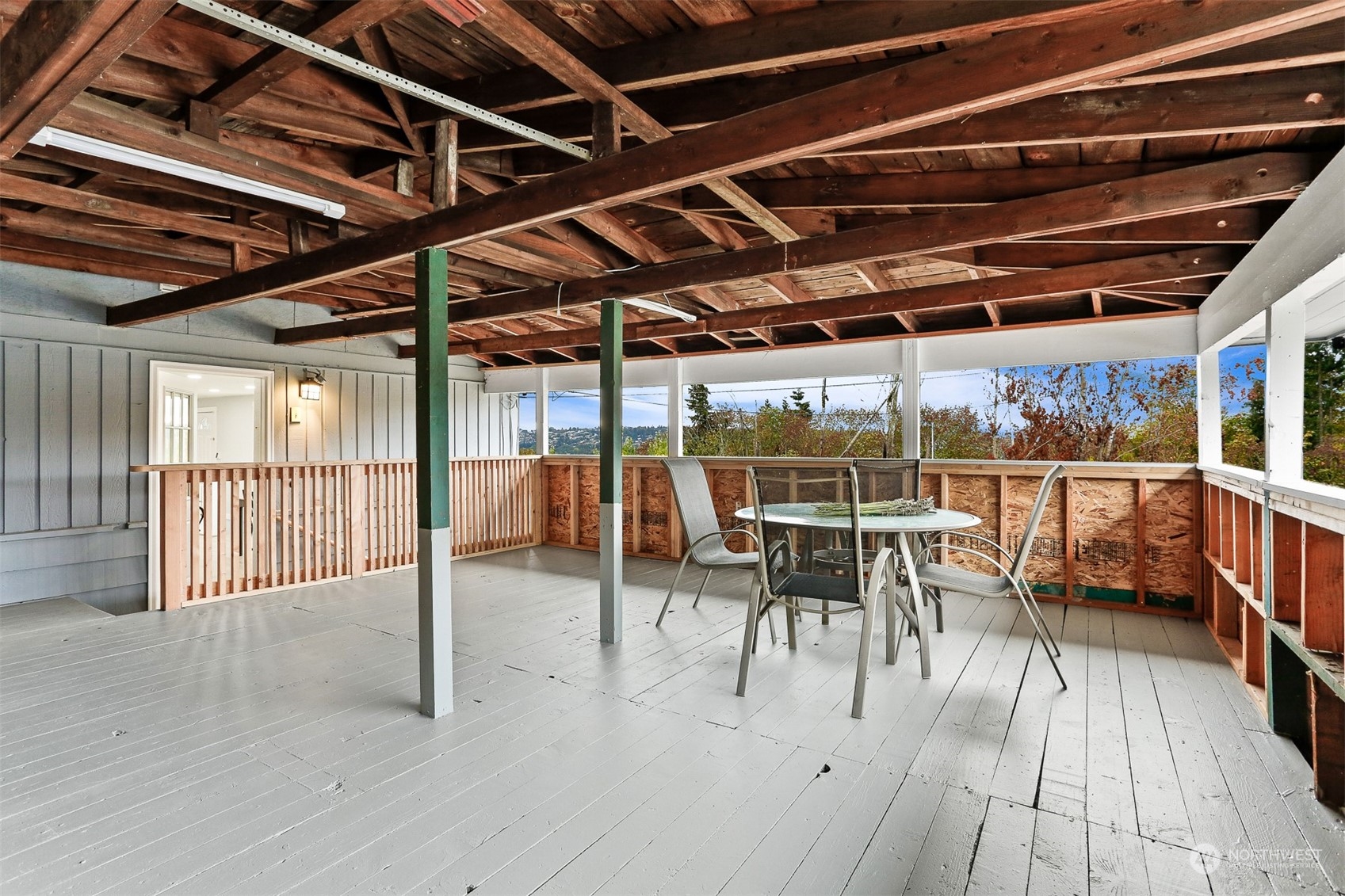 2124 High Avenue Northeast Renton, WA 98056 - Photo 34 of 37 a view of a roof deck with a table and chairs
