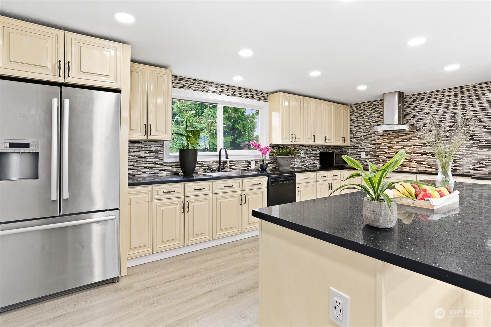 2124 High Avenue Northeast Renton, WA 98056 - Photo 4 of 37 a kitchen with stainless steel appliances granite countertop a refrigerator a sink dishwasher a stove and white cabinets with wooden floor