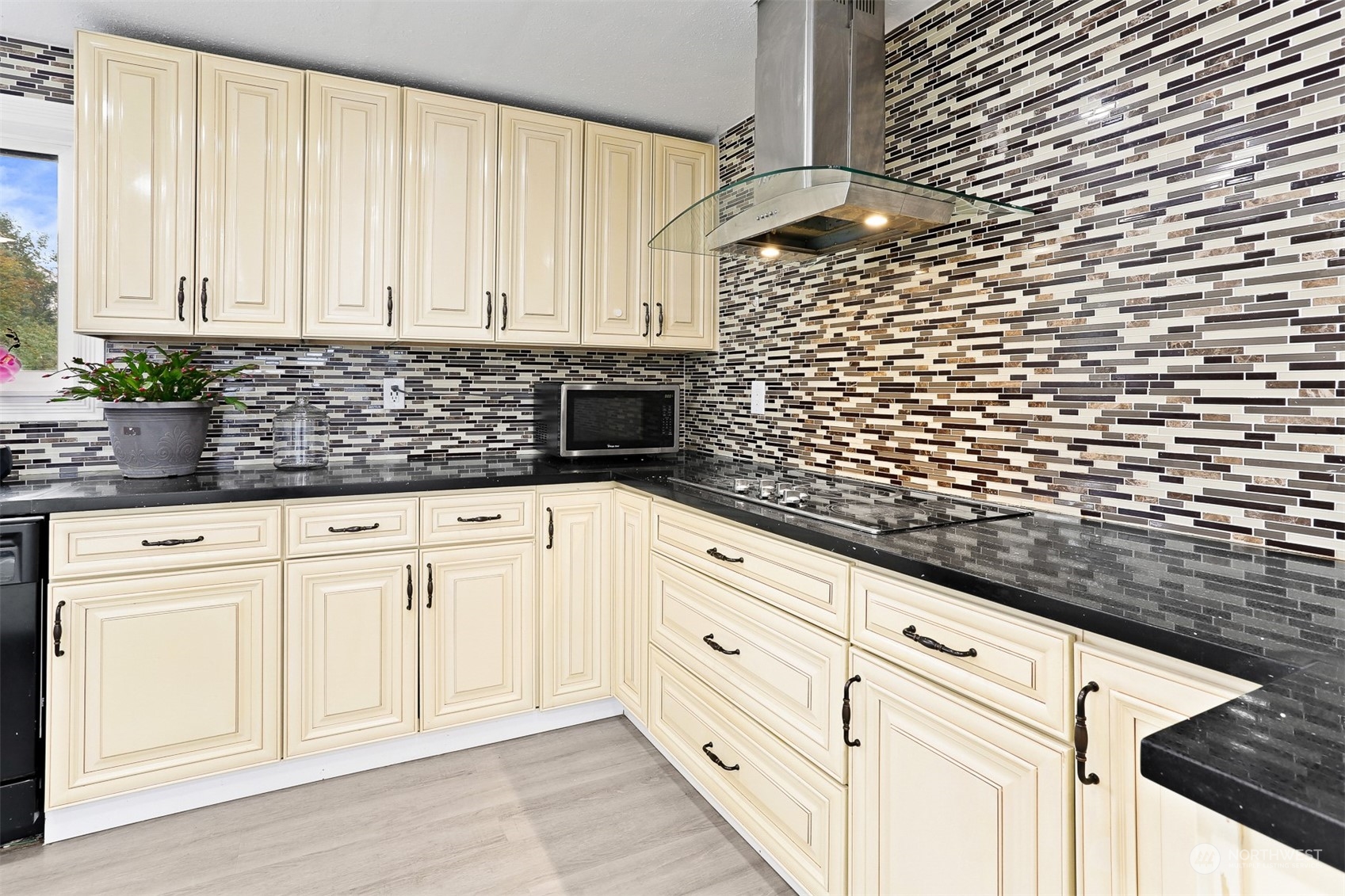 2124 High Avenue Northeast Renton, WA 98056 - Photo 7 of 37 a kitchen with granite countertop white cabinets and white appliances