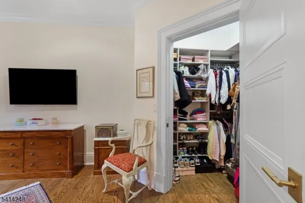 a view of a workspace with furniture and closet