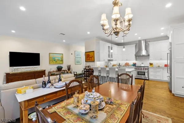 a living room with dining room and kitchen view