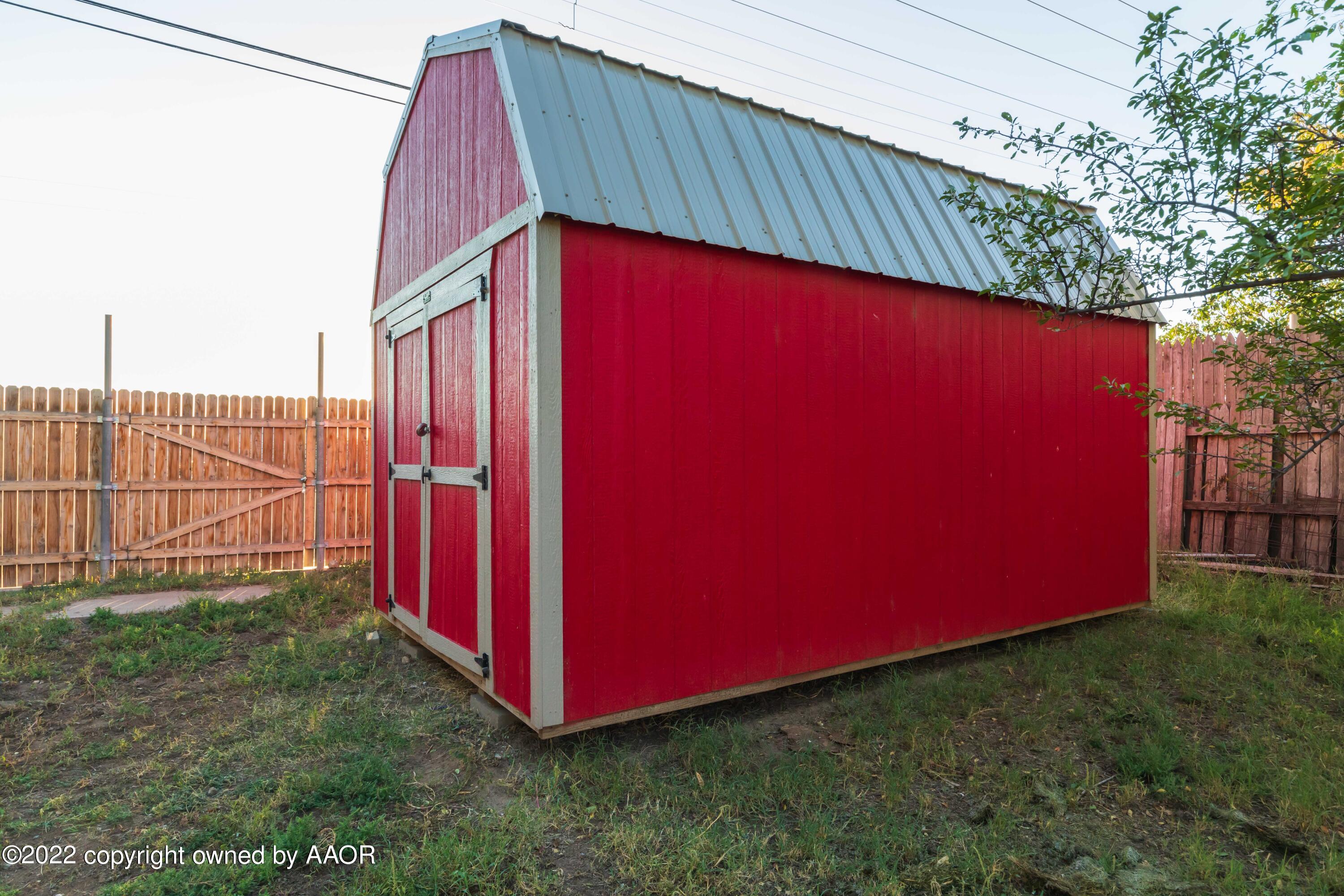 4633 South Hughes Street Amarillo, TX 79110 - Photo 23 of 23 a view of a backyard with wooden fence