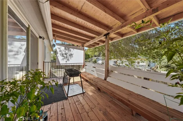 a view of a balcony with chairs