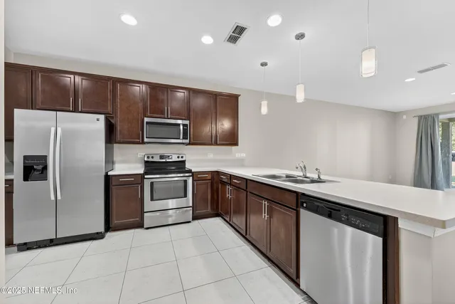 a kitchen with a stove and a microwave