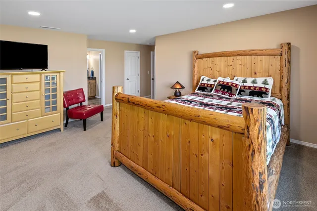 a view of a livingroom with furniture and a flat screen tv