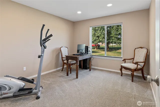 a work room with furniture and a window