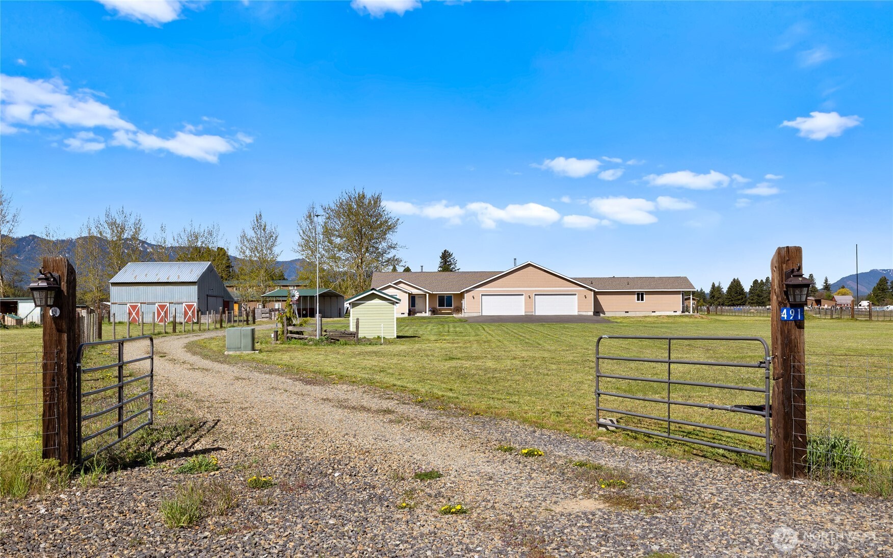 491 Pease Road Cle Elum, WA 98922 - Photo 36 of 38 a view of a large house with a big yard and large trees